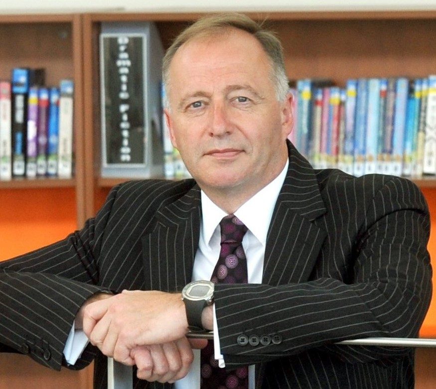 Delta CEO, Paul Tarn in a library
